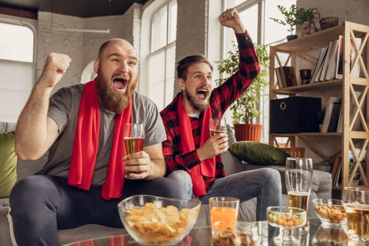 excited-happy-friends-watch-sport-match-together-2024-10-11-11-53-42-utc